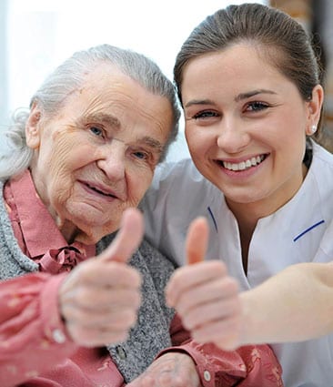 old woman and young woman thumbs up